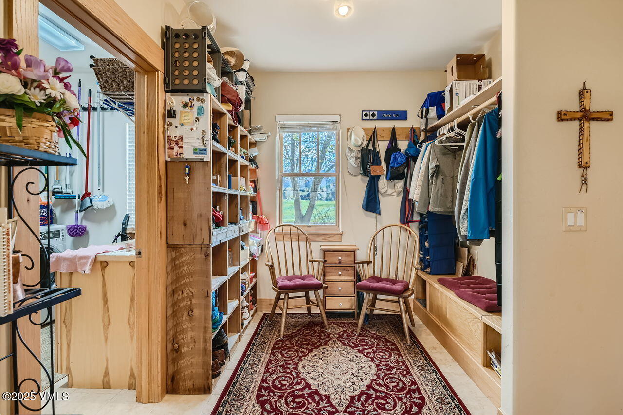 1987 Eagle Ranch Road Eagle, CO 81631 - Photo 32 of 37 a view of an entryway with furniture and toys