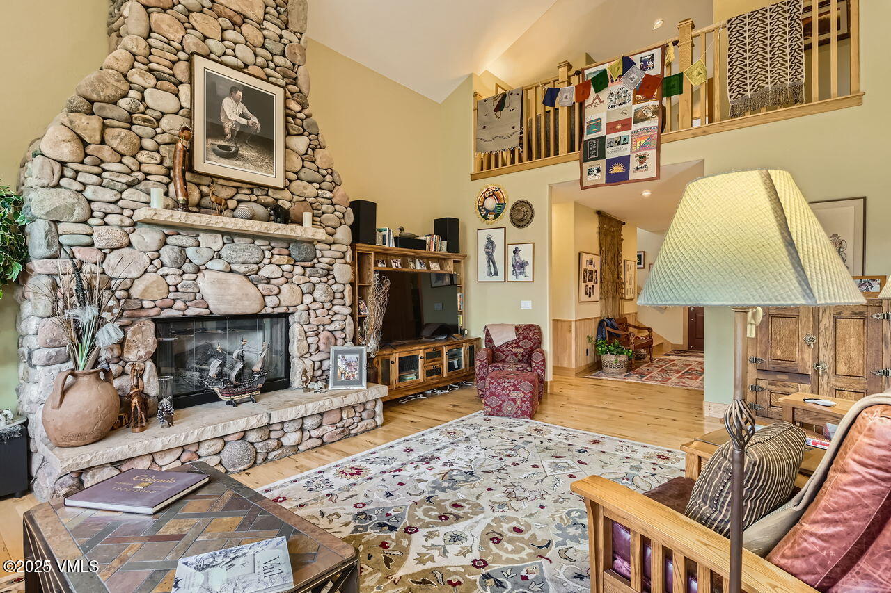 1987 Eagle Ranch Road Eagle, CO 81631 - Photo 4 of 37 a living room with furniture and a fireplace