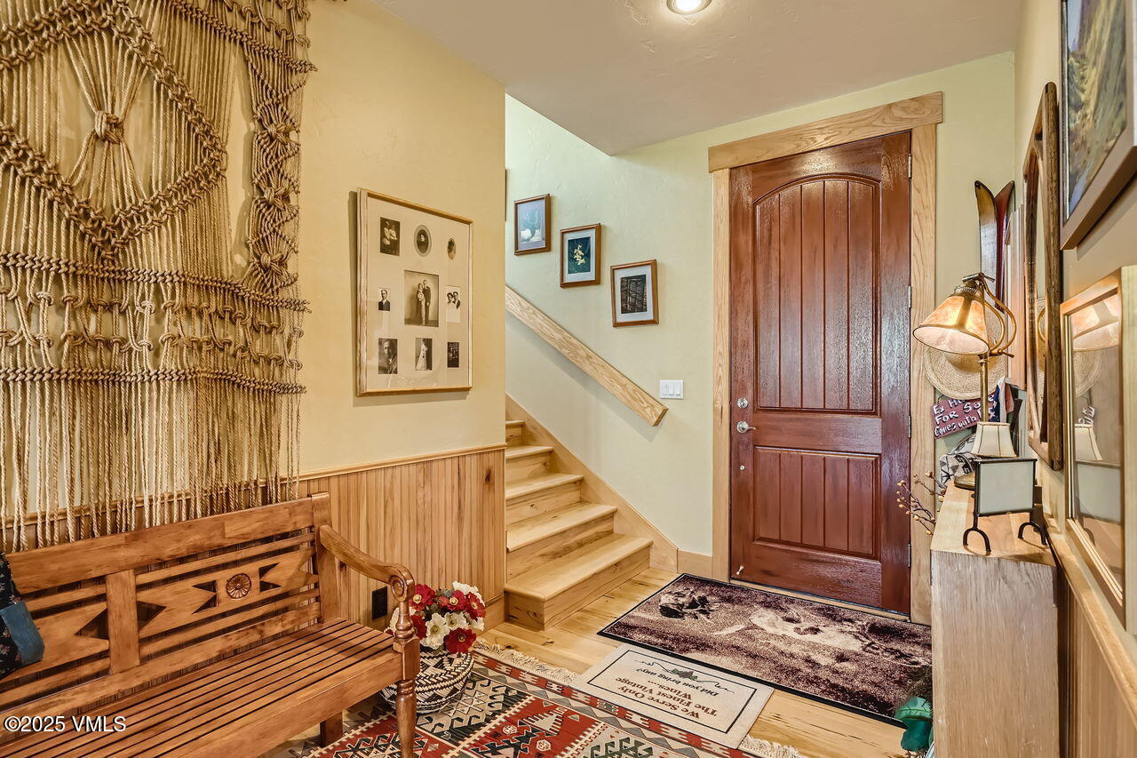 1987 Eagle Ranch Road Eagle, CO 81631 - Photo 7 of 37 a view of a hallway with couches and dining table