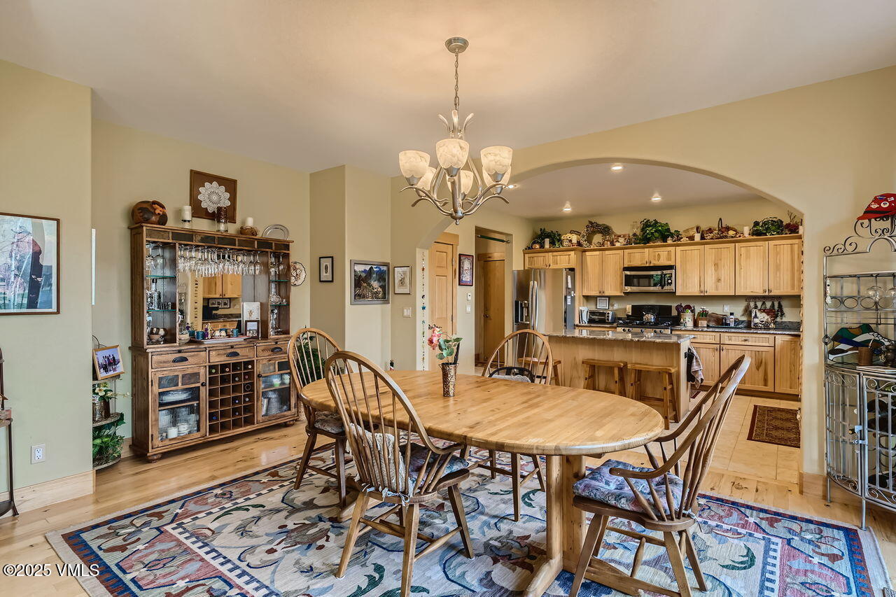 1987 Eagle Ranch Road Eagle, CO 81631 - Photo 9 of 37 a view of a dining room with furniture and wooden floor