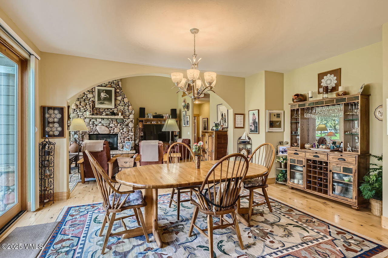 1987 Eagle Ranch Road Eagle, CO 81631 - Photo 10 of 37 a view of a dining room with furniture and chandelier