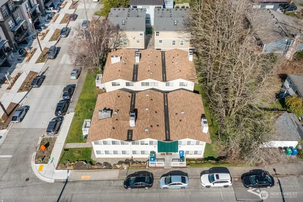 an aerial view of residential houses with outdoor space
