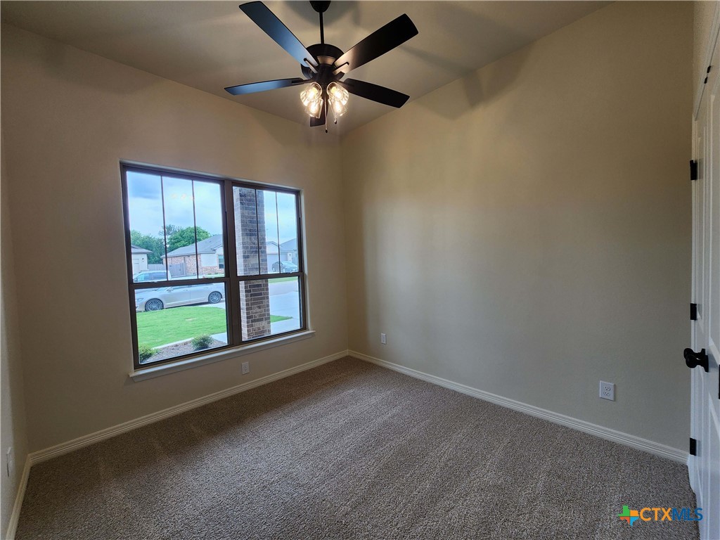 406 Talon Loop Salado, TX 76571 - Photo 12 of 31 an empty room with windows and fan