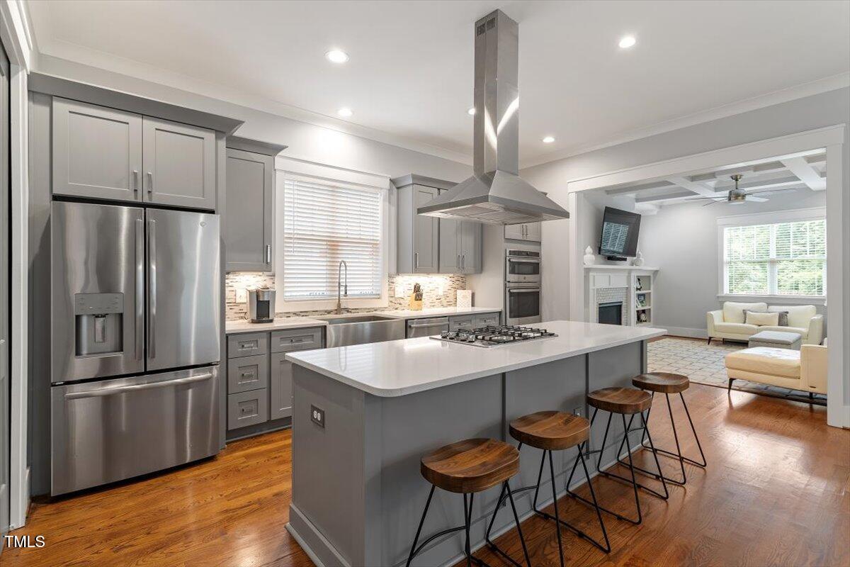 1215 Brookside Drive Raleigh, NC 27604 - Photo 11 of 34 a kitchen with granite countertop a sink appliances a counter space and dining table