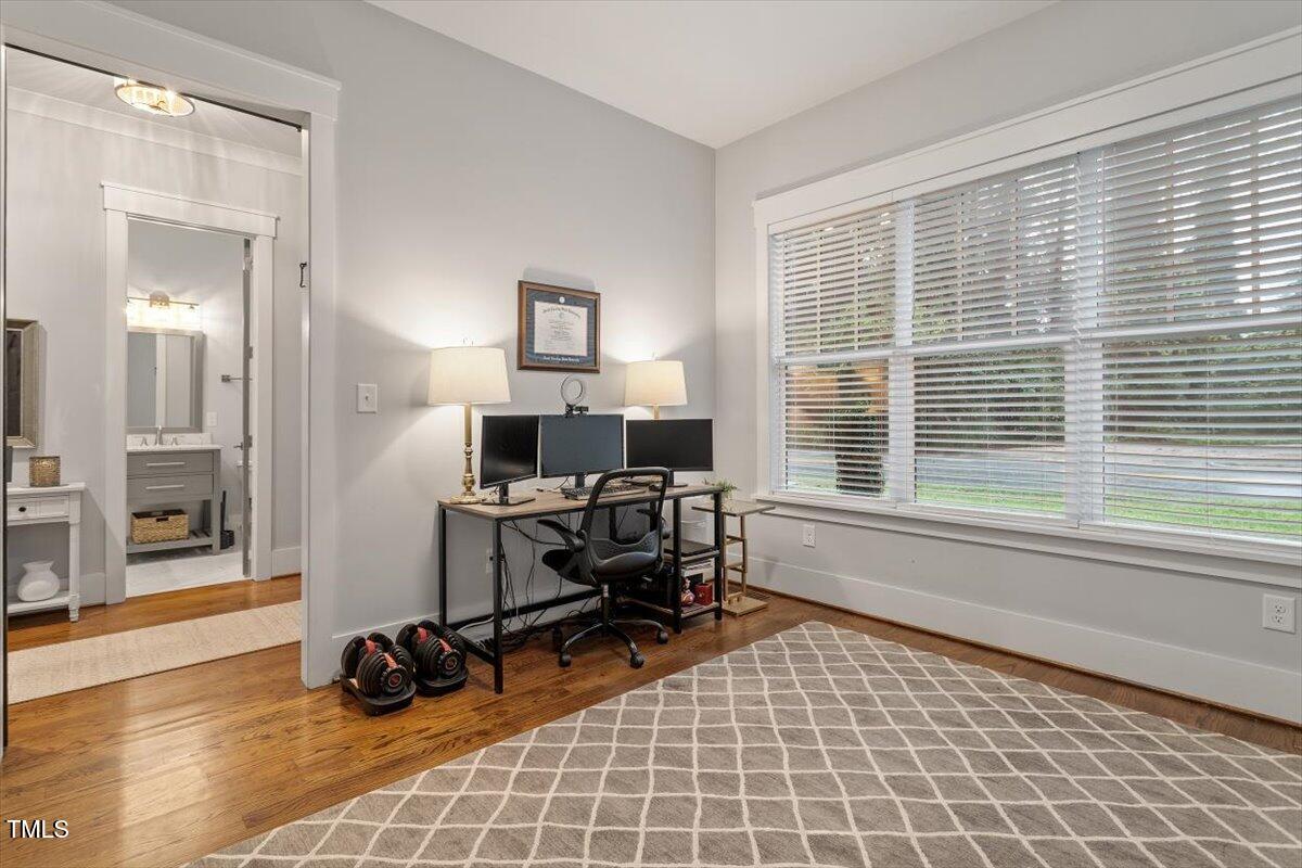 1215 Brookside Drive Raleigh, NC 27604 - Photo 18 of 34 a view of a workspace with furniture and a window