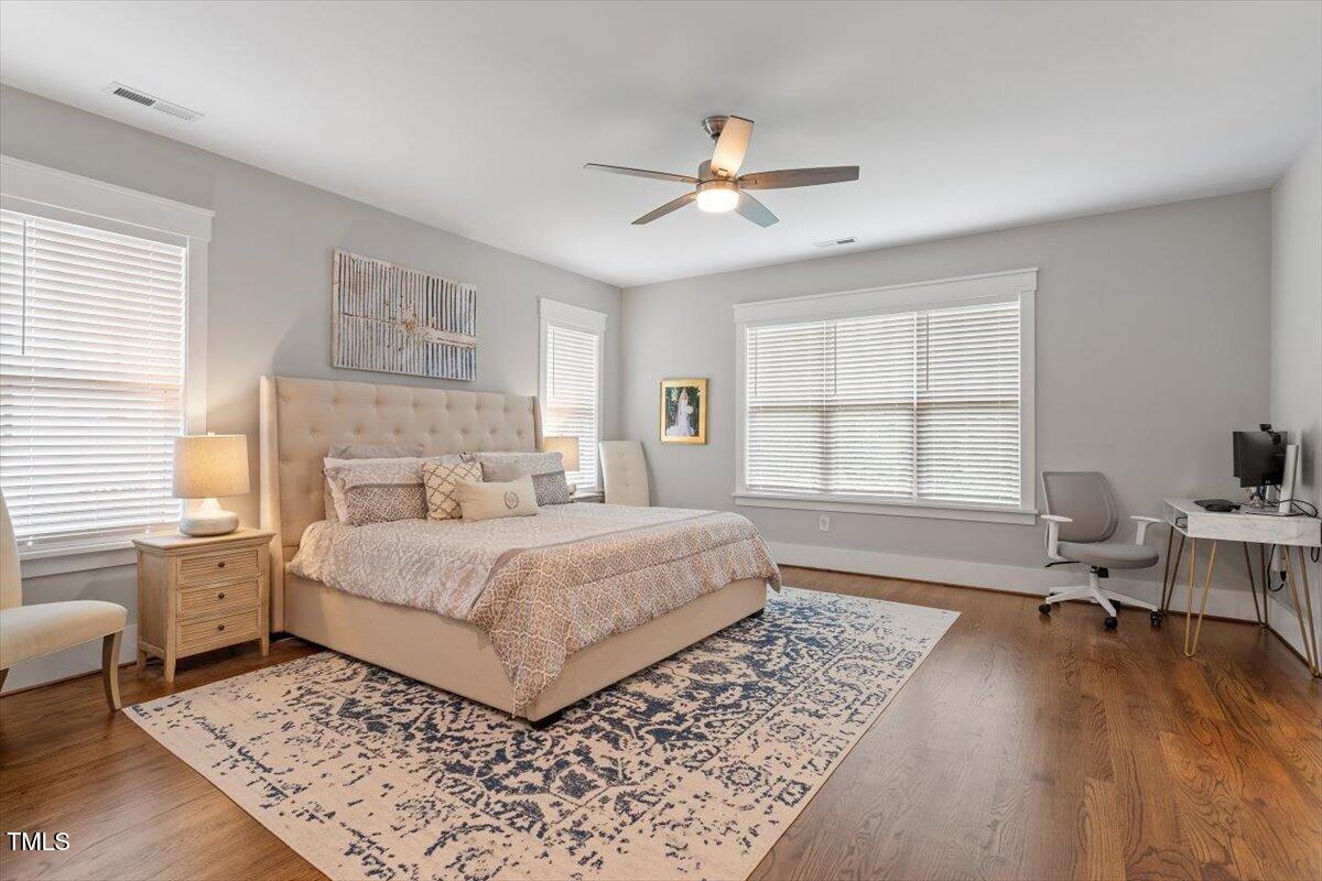 1215 Brookside Drive Raleigh, NC 27604 - Photo 19 of 34 a bedroom with a large bed and a window