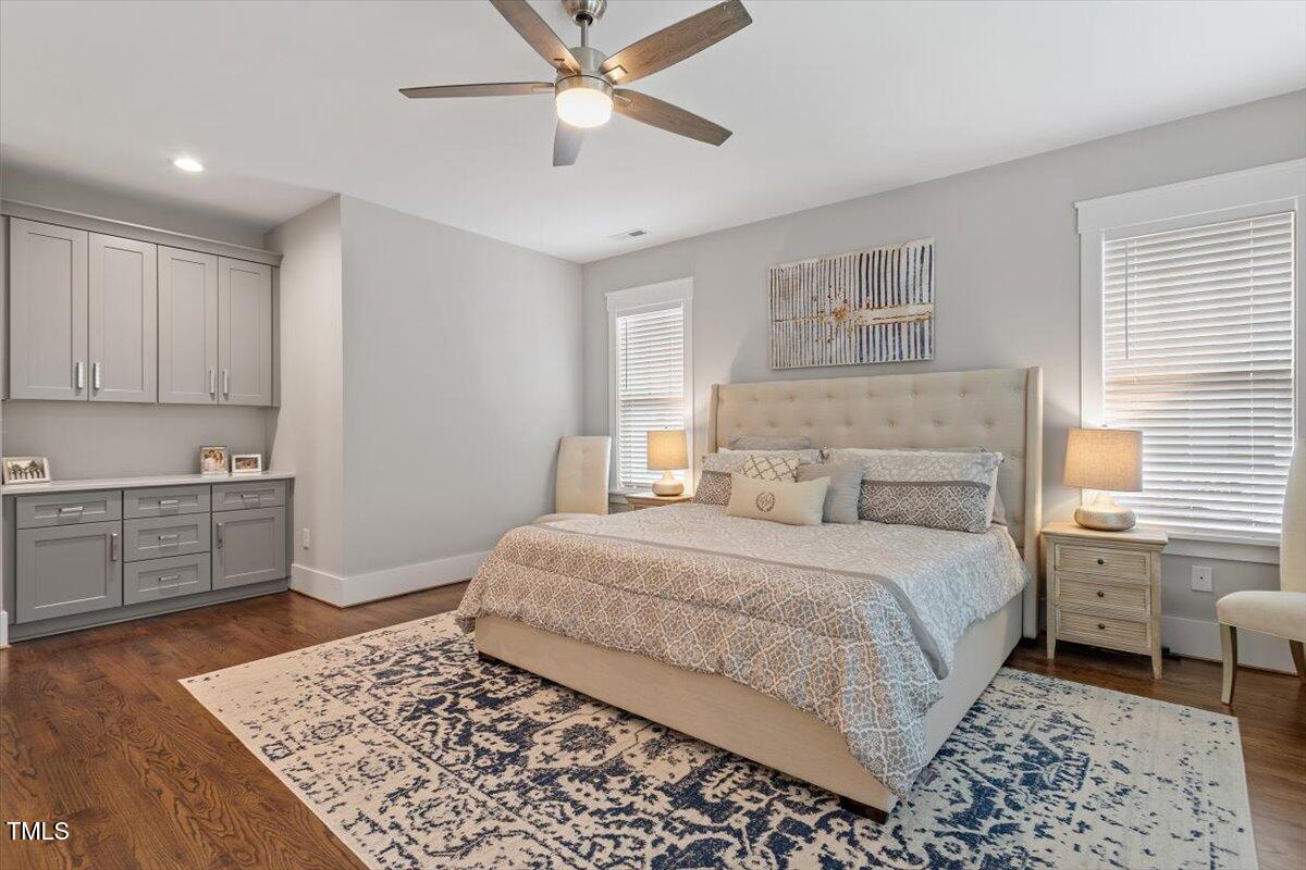 1215 Brookside Drive Raleigh, NC 27604 - Photo 21 of 34 a bedroom with a large bed and a window