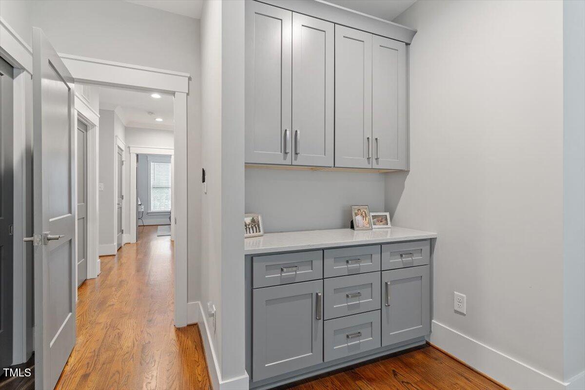 1215 Brookside Drive Raleigh, NC 27604 - Photo 22 of 34 a view of cabinets with wooden floor