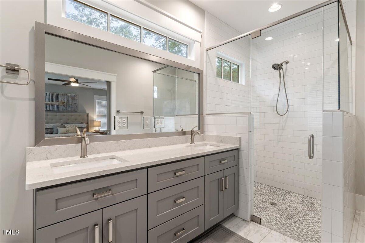 1215 Brookside Drive Raleigh, NC 27604 - Photo 25 of 34 a bathroom with a granite countertop sink mirror and double
