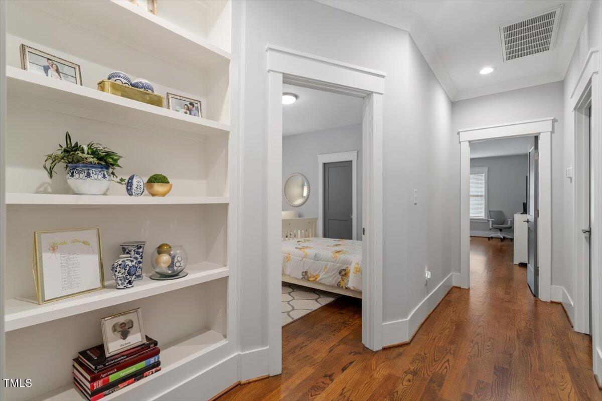 1215 Brookside Drive Raleigh, NC 27604 - Photo 26 of 34 a view of hallway with wooden floor