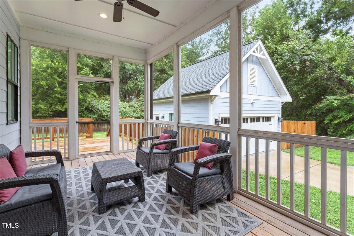 1215 Brookside Drive Raleigh, NC 27604 - Photo 30 of 34 a balcony with wooden floor and outdoor seating