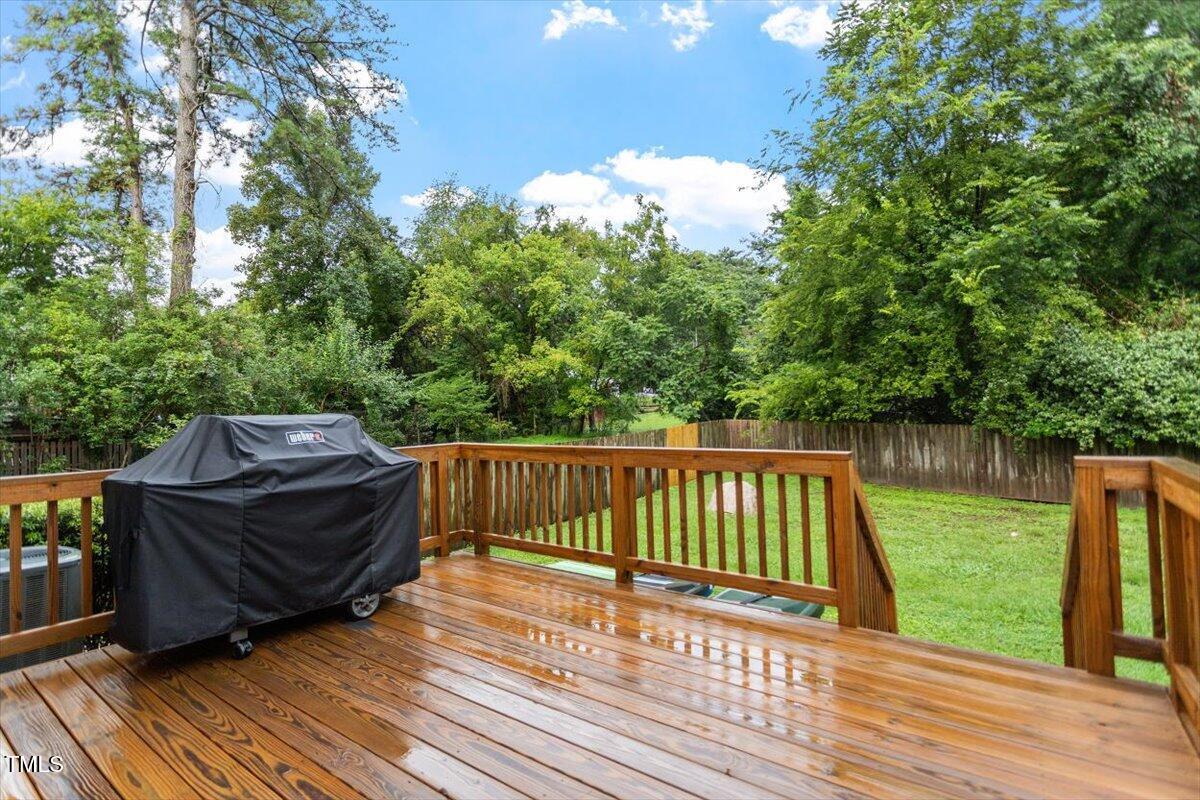 1215 Brookside Drive Raleigh, NC 27604 - Photo 33 of 34 a view of balcony with wooden floor and fence