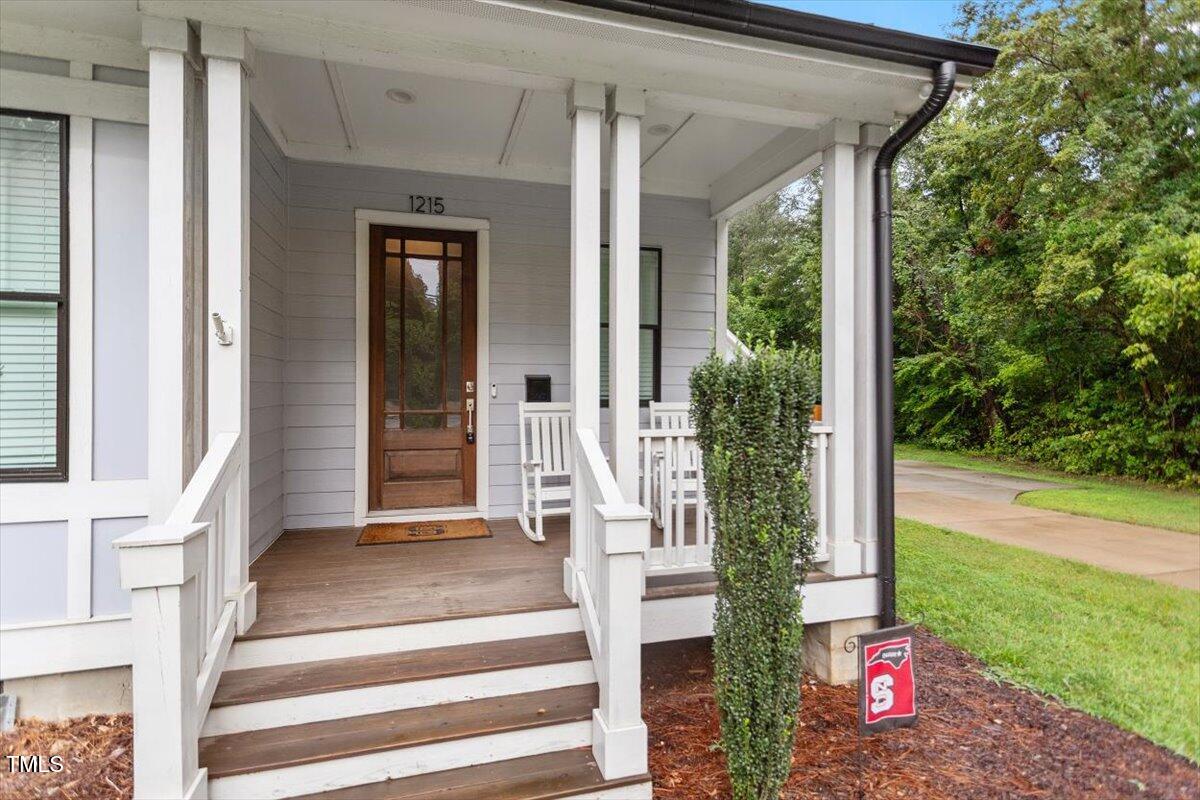 1215 Brookside Drive Raleigh, NC 27604 - Photo 4 of 34 a front view of a house with garden