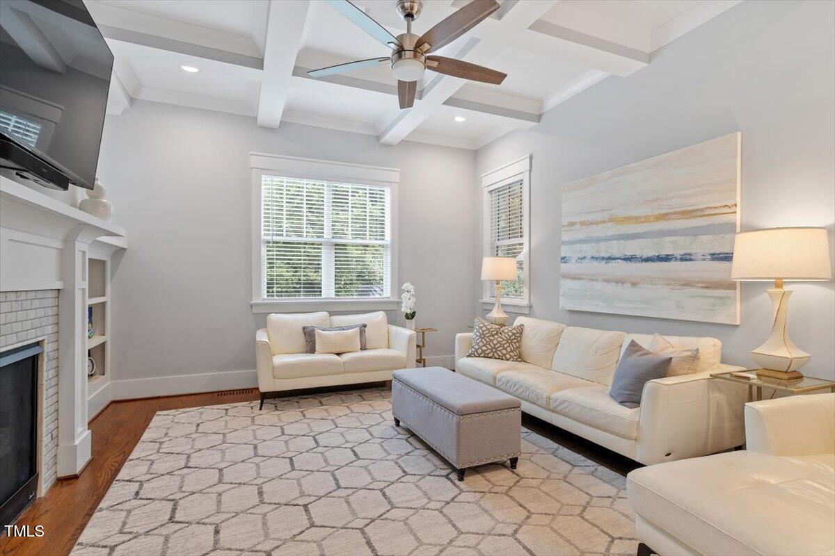 1215 Brookside Drive Raleigh, NC 27604 - Photo 6 of 34 a living room with furniture and a flat screen tv