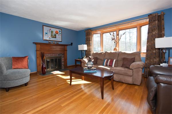 8 Michael Road Billerica, MA 01862 - Photo 2 of 10 a living room with furniture a large window and a fireplace