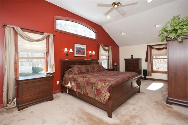 8 Michael Road Billerica, MA 01862 - Photo 5 of 10 a spacious bedroom with a bed and a window