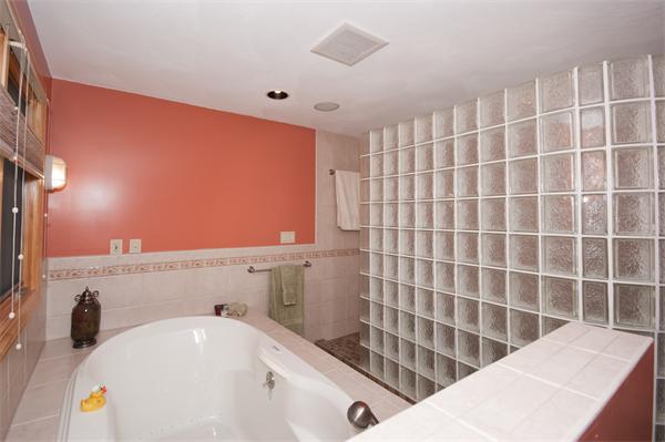 8 Michael Road Billerica, MA 01862 - Photo 7 of 10 a bathroom with a bathtub and sink