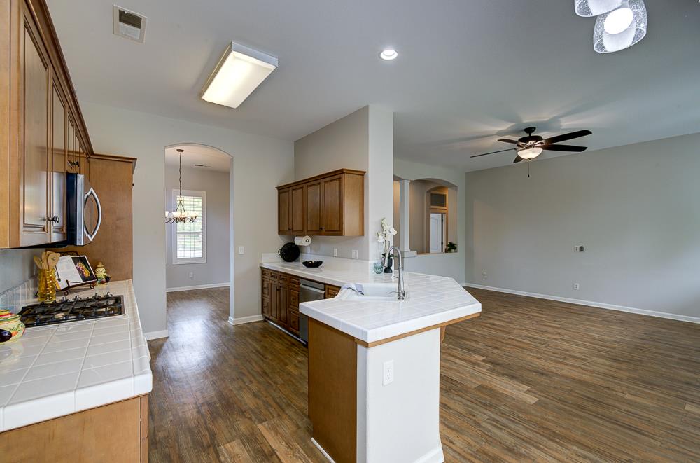 3235 Rall Avenue Clovis, CA 93619 - Photo 13 of 33 a living room with furniture and a flat screen tv