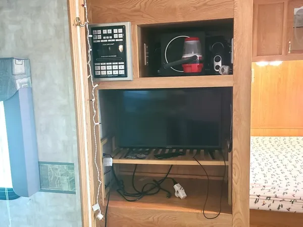 a view of a room with a table and chairs