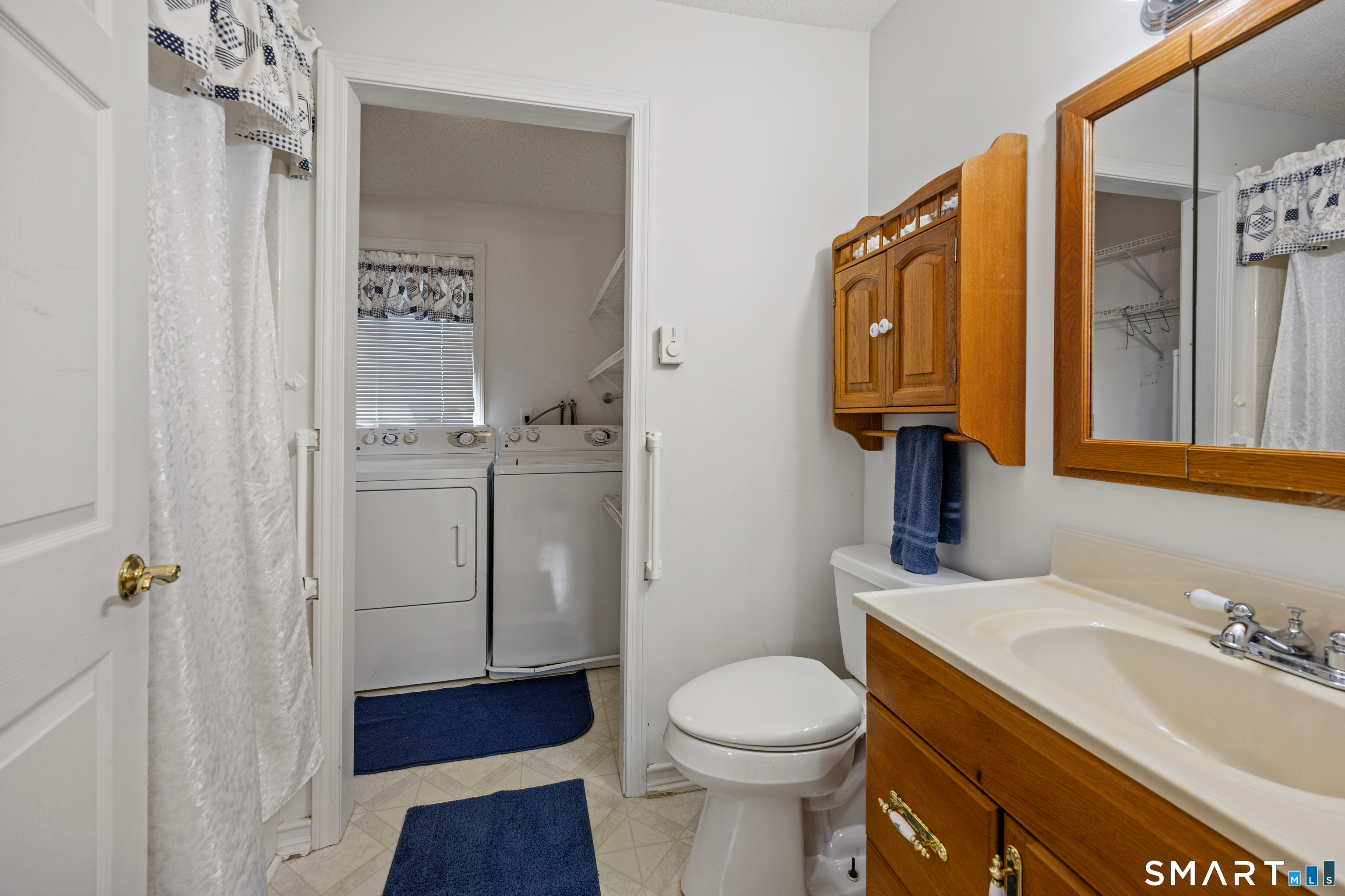 42 Chimney Sweep Road Wallingford, CT 06492 - Photo 35 of 40 a bathroom with a sink a toilet and shower
