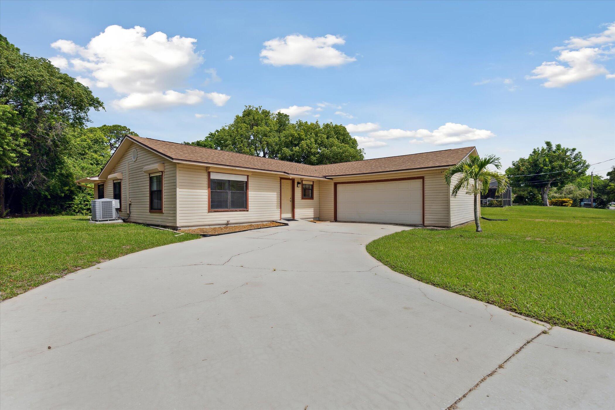 1045 Garden Road Merritt Island, FL 32952 - Photo 1 of 37 a view of an house with backyard space and garden