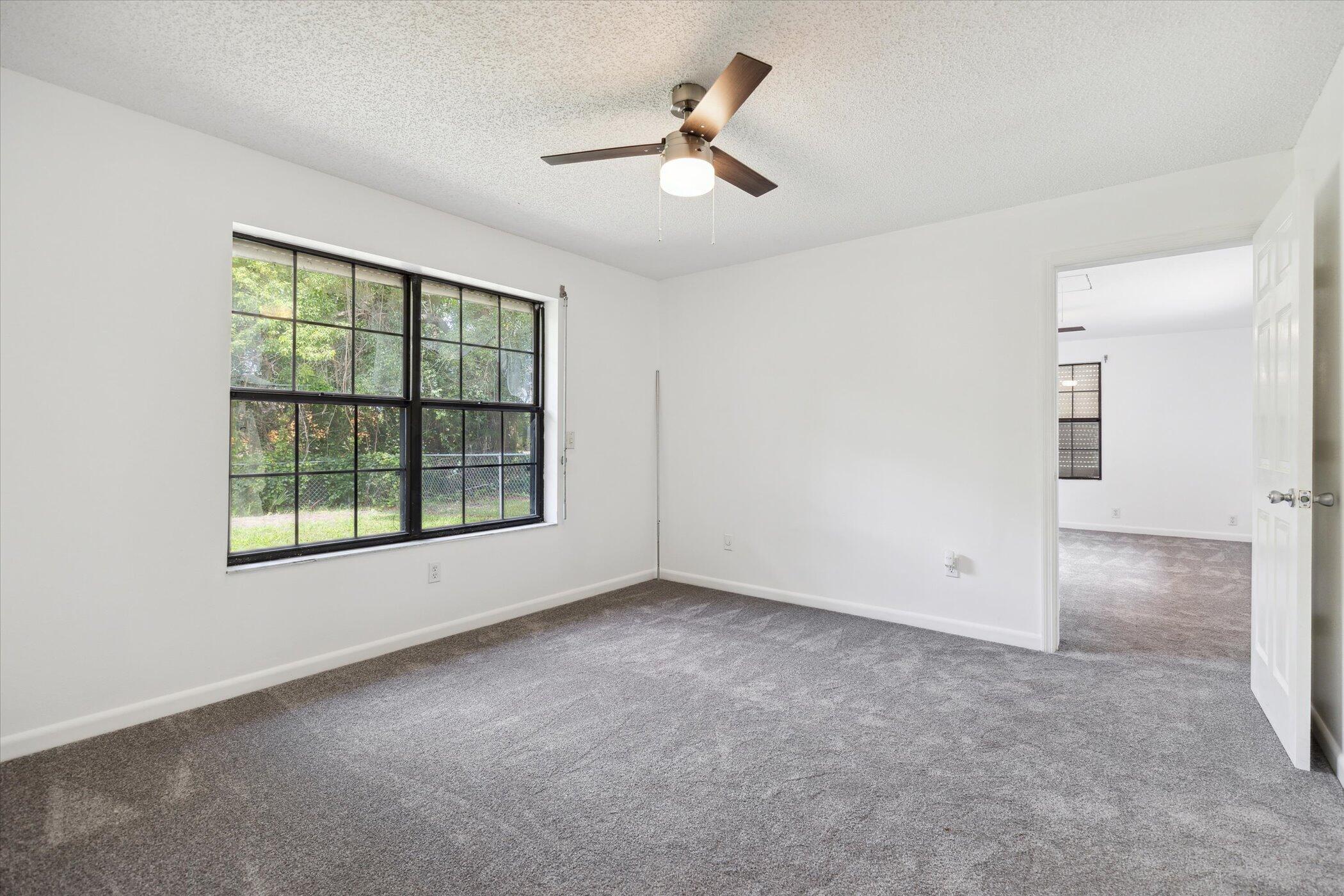 1045 Garden Road Merritt Island, FL 32952 - Photo 15 of 37 an empty room with a empty space and a ceiling fan