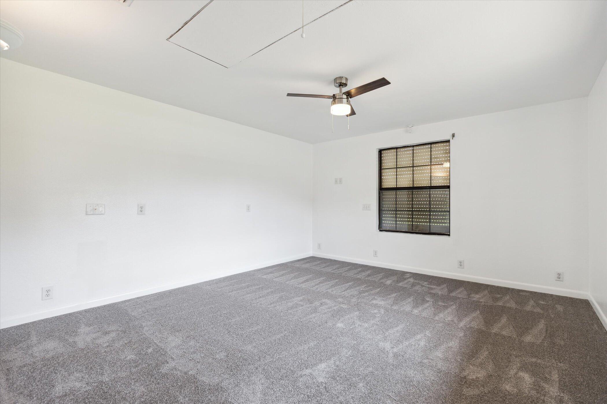 1045 Garden Road Merritt Island, FL 32952 - Photo 21 of 37 an empty room with windows