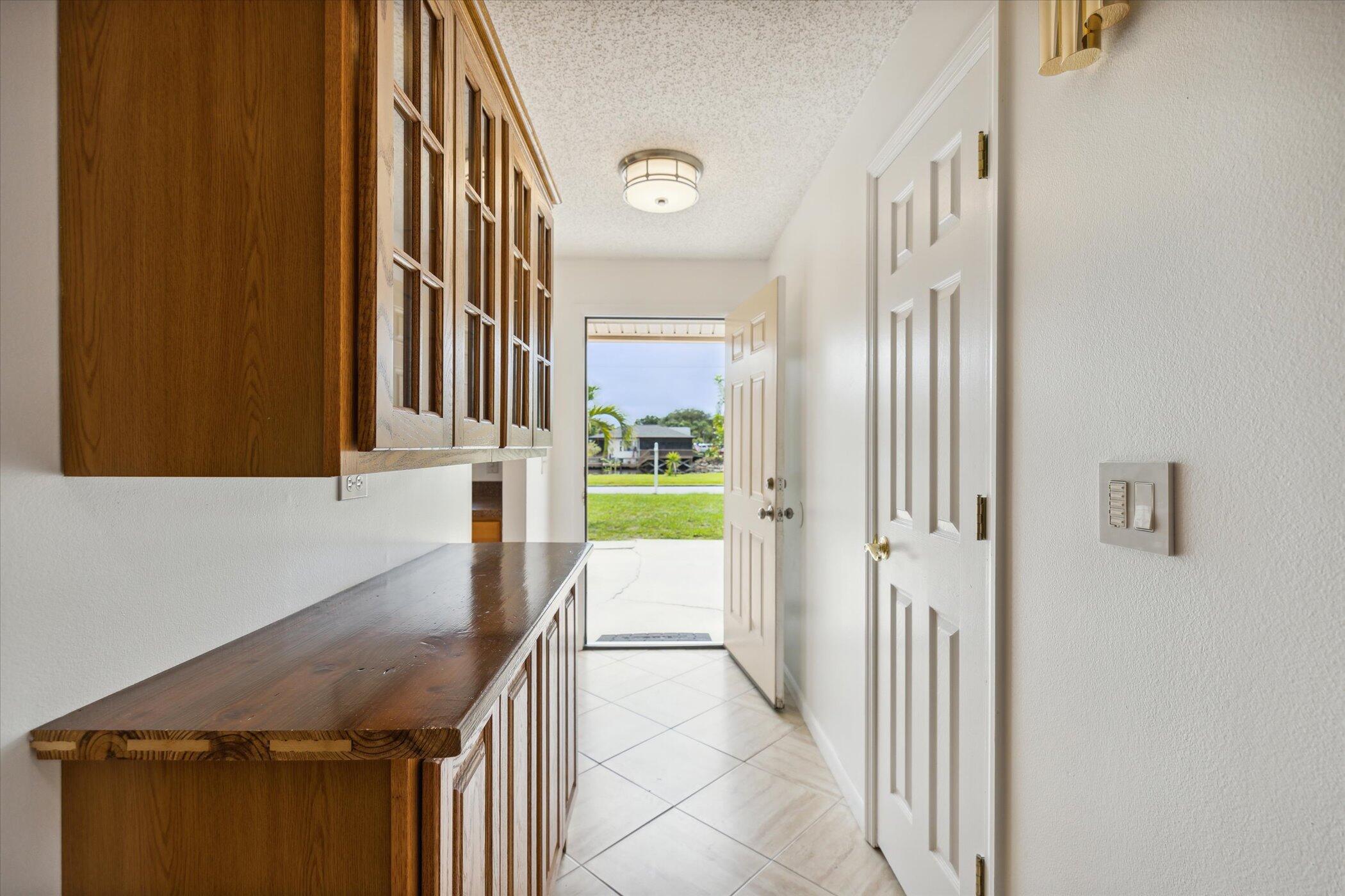 1045 Garden Road Merritt Island, FL 32952 - Photo 23 of 37 a bathroom with a granite countertop sink and a mirror