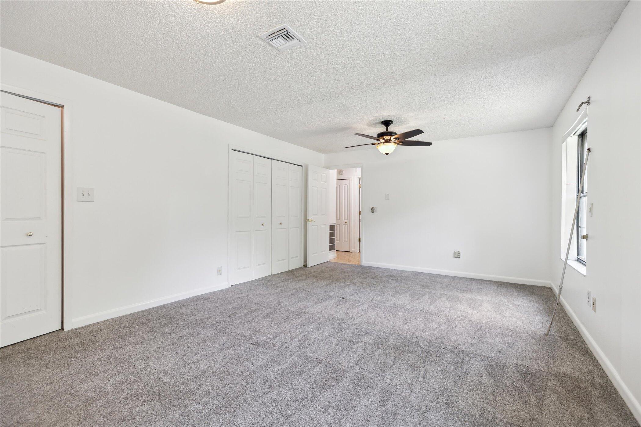 1045 Garden Road Merritt Island, FL 32952 - Photo 28 of 37 a view of a livingroom with a ceiling fan