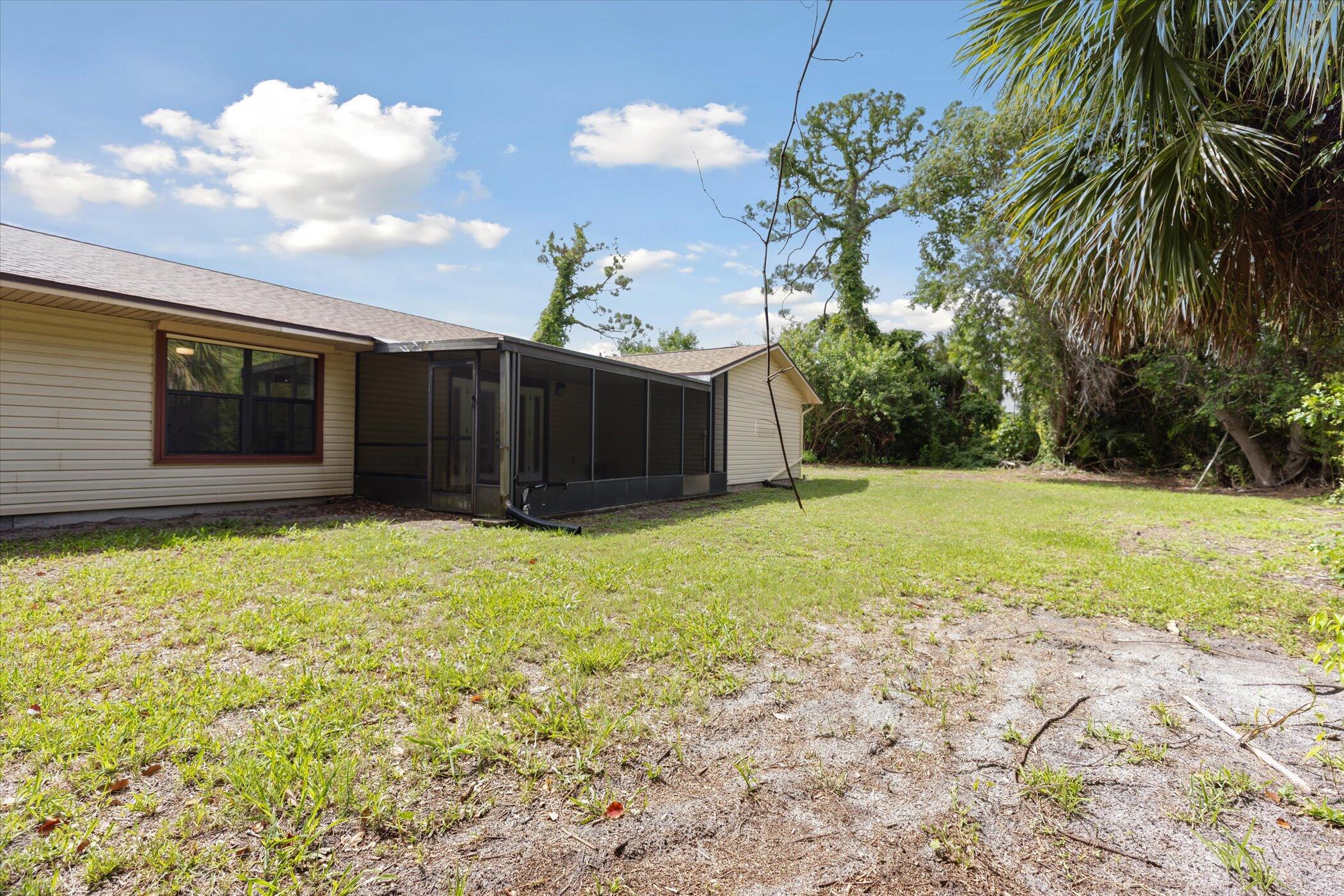 1045 Garden Road Merritt Island, FL 32952 - Photo 33 of 37 a view of a backyard of the house