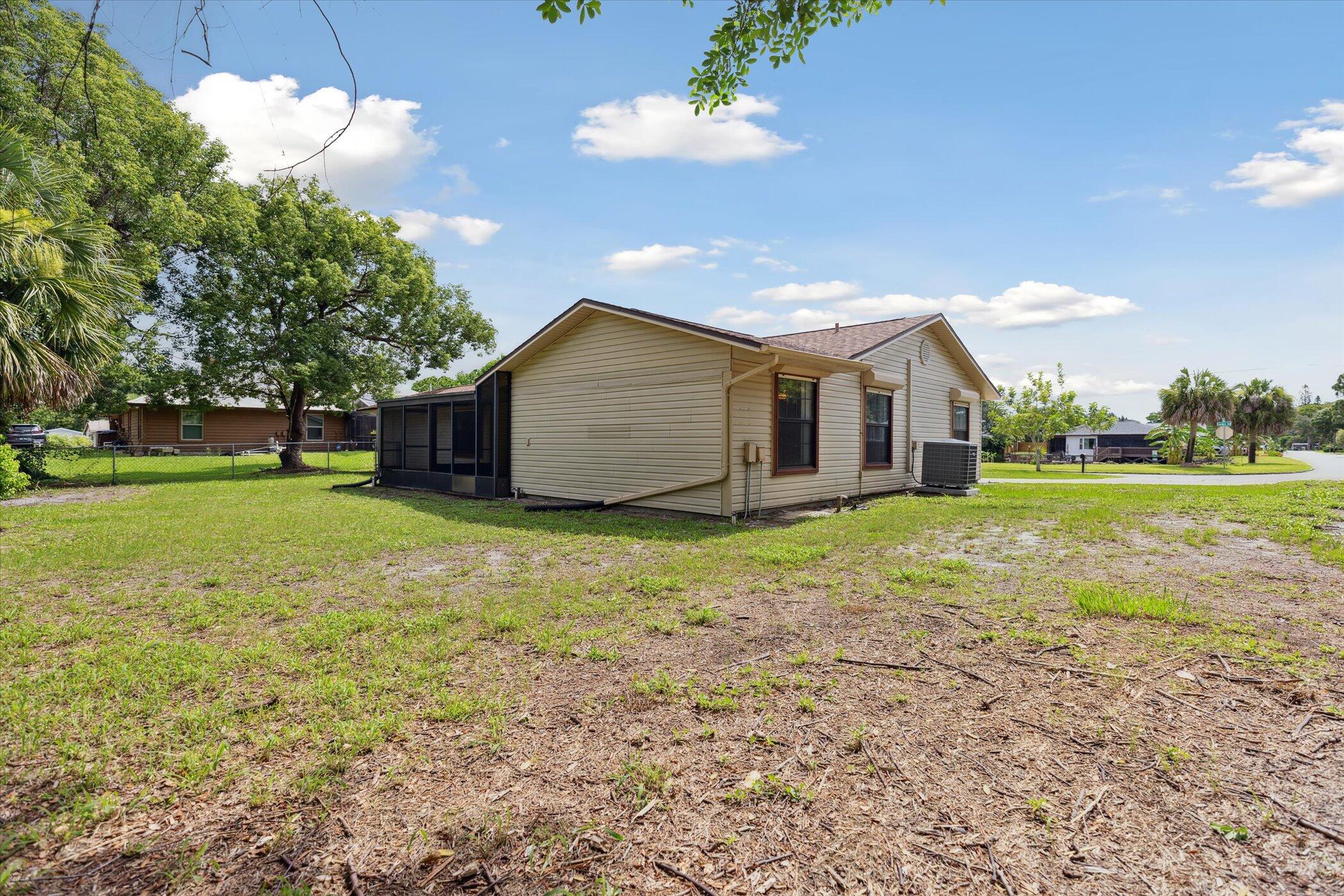 1045 Garden Road Merritt Island, FL 32952 - Photo 35 of 37 a view of a house with backyard and tree s
