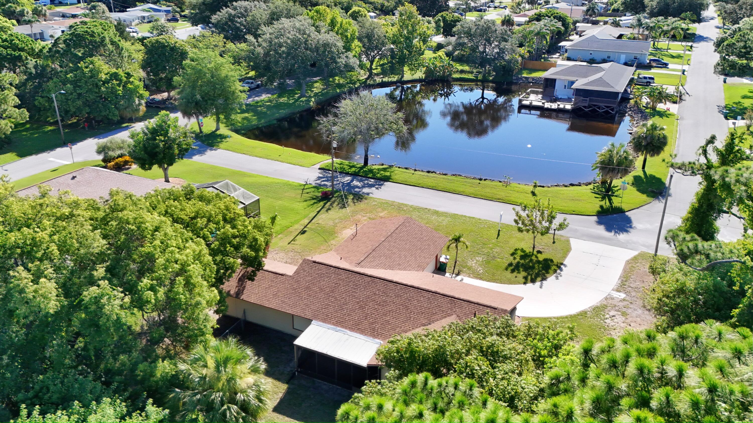 1045 Garden Road Merritt Island, FL 32952 - Photo 4 of 37 an aerial view of a house with a garden