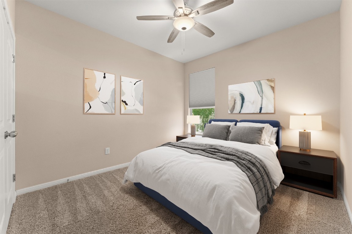 7709 Menchaca Road, Unit 5 Austin, TX 78745 - Photo 16 of 21 a bedroom with a bed and a chandelier