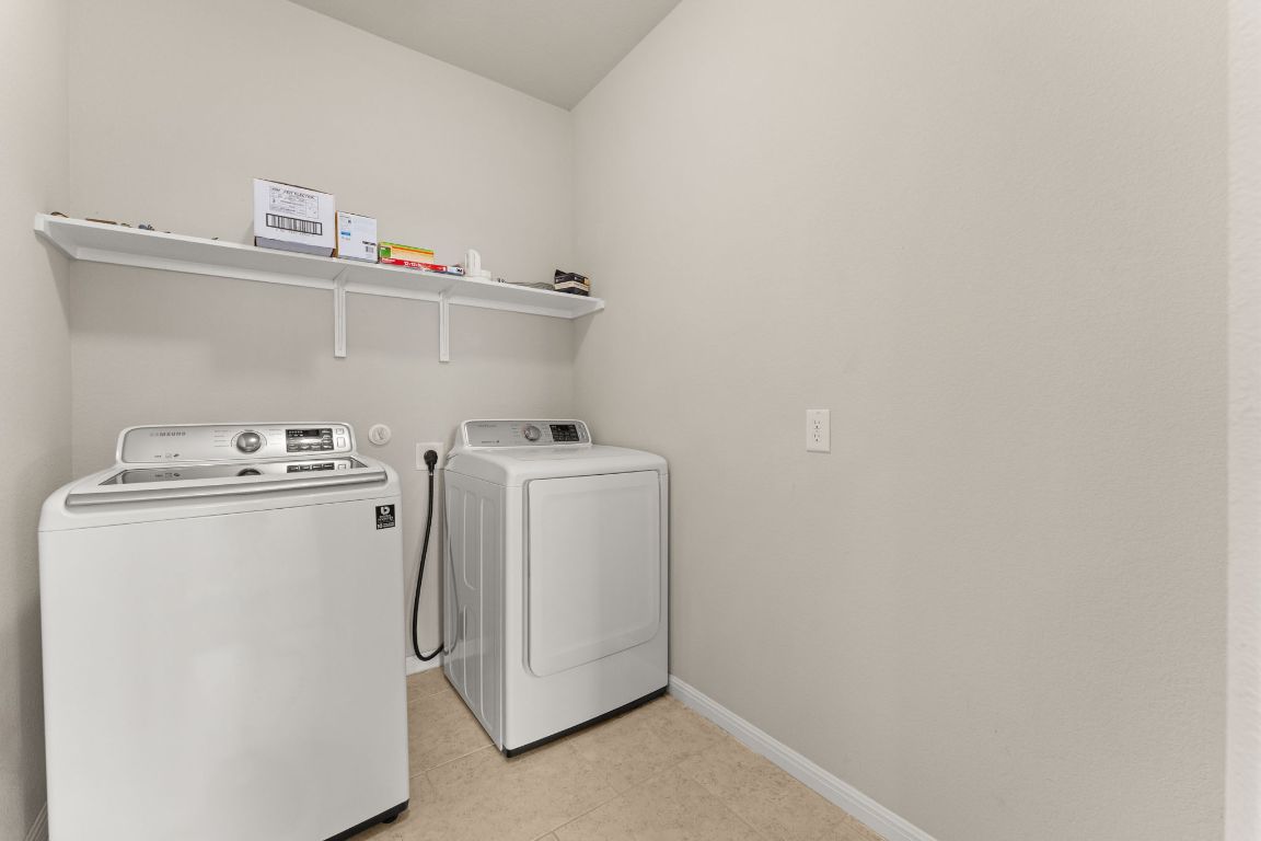 7709 Menchaca Road, Unit 5 Austin, TX 78745 - Photo 19 of 21 a utility room with dryer and washer