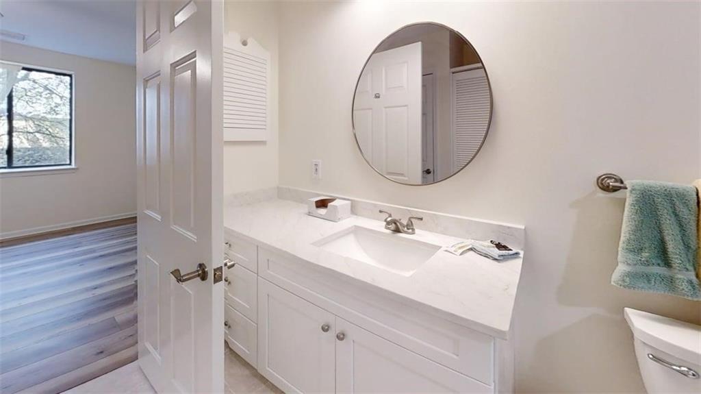 300 Johnson Ferry Road, Unit A312 Atlanta, GA 30328 - Photo 13 of 31 a bathroom with a sink and a mirror