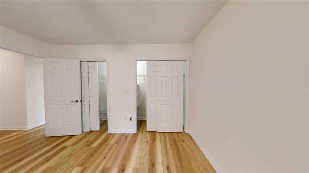 300 Johnson Ferry Road, Unit A312 Atlanta, GA 30328 - Photo 19 of 31 a view of a livingroom with wooden floor and closet