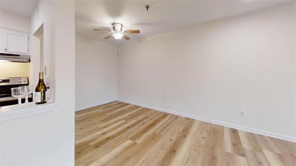 300 Johnson Ferry Road, Unit A312 Atlanta, GA 30328 - Photo 2 of 31 a view of a room with wooden floor