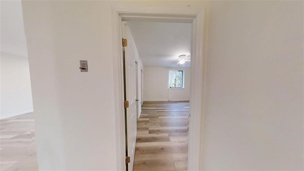 300 Johnson Ferry Road, Unit A312 Atlanta, GA 30328 - Photo 21 of 31 a view of a hallway with front door wooden floor and windows