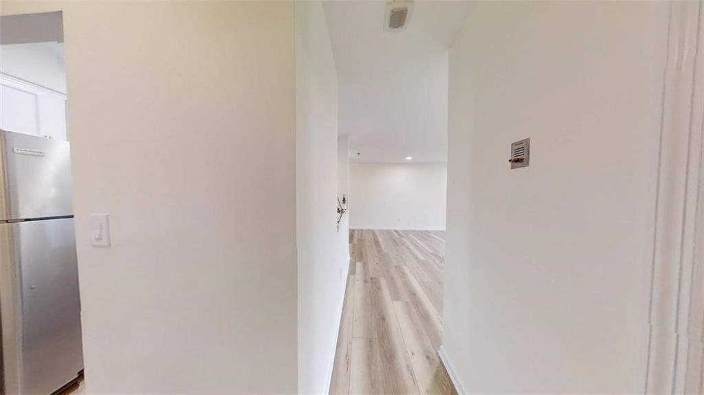 300 Johnson Ferry Road, Unit A312 Atlanta, GA 30328 - Photo 22 of 31 a view of a room with wooden floor