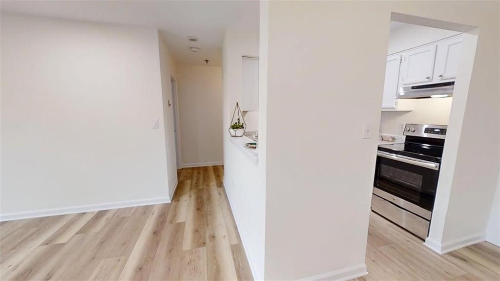 300 Johnson Ferry Road, Unit A312 Atlanta, GA 30328 - Photo 28 of 31 a view of a kitchen from the hallway