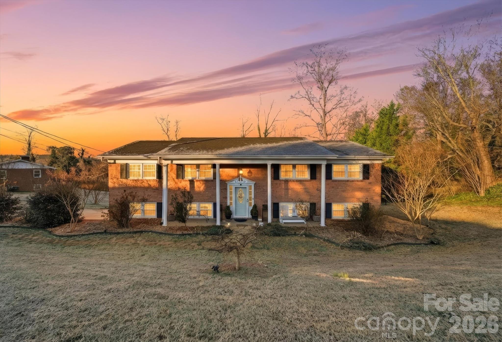 a front view of a house with a yard