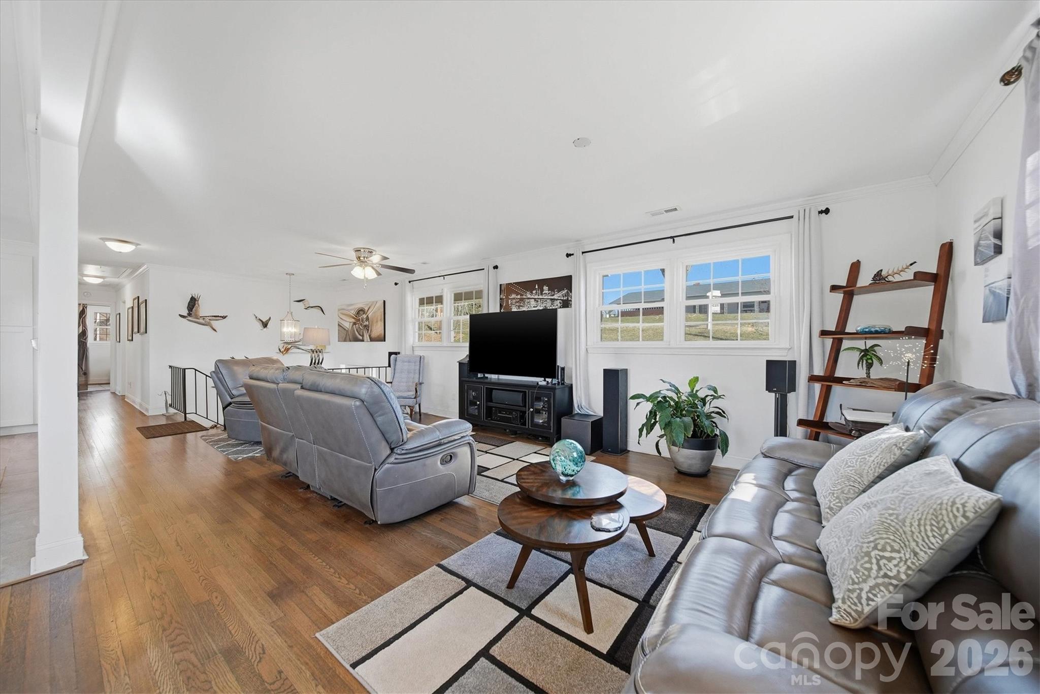 6719 Lakeview Terrace Hickory, NC 28601 - Photo 16 of 41 a living room with furniture and a flat screen tv