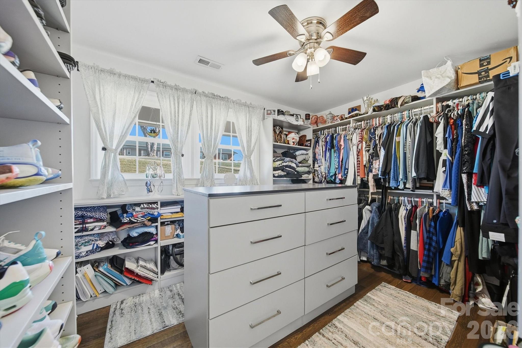 6719 Lakeview Terrace Hickory, NC 28601 - Photo 21 of 41 a view of walk in closet with clothes and shoes