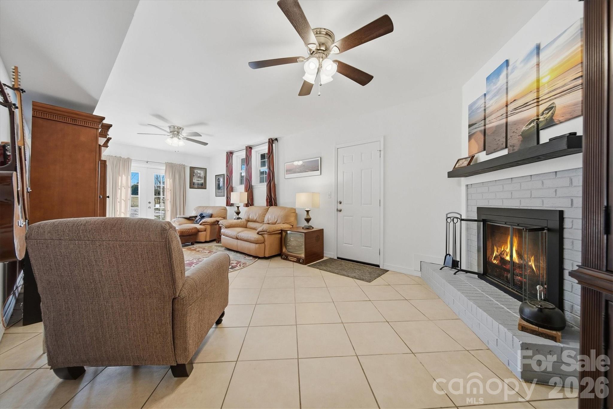 6719 Lakeview Terrace Hickory, NC 28601 - Photo 24 of 41 a living room with furniture and a fireplace