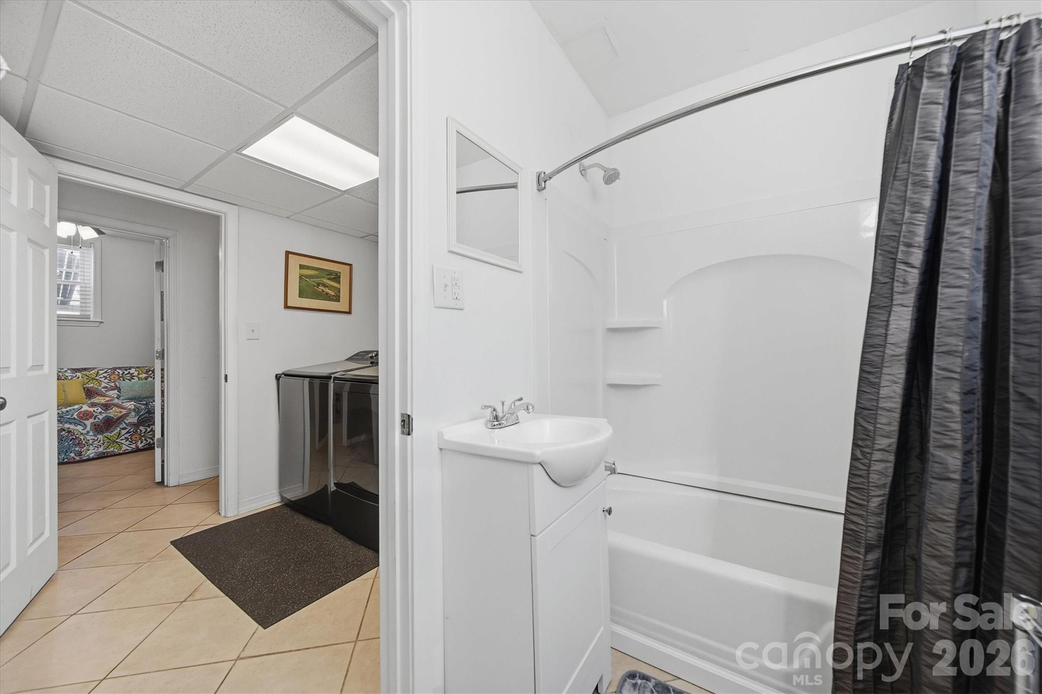 6719 Lakeview Terrace Hickory, NC 28601 - Photo 32 of 41 a bathroom with a sink and a mirror