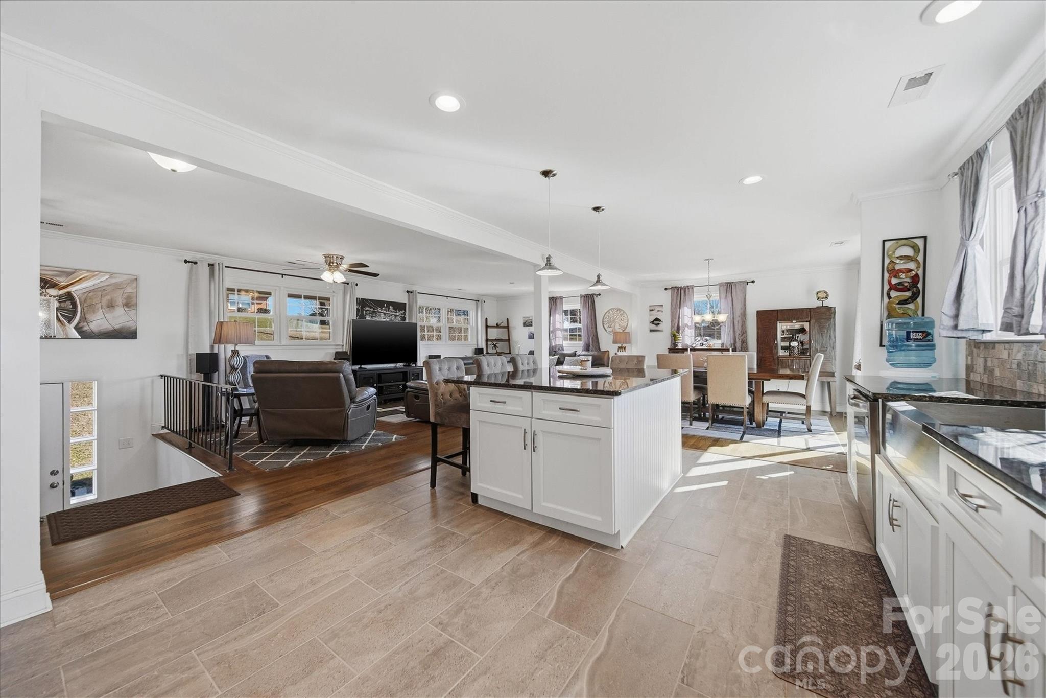 6719 Lakeview Terrace Hickory, NC 28601 - Photo 7 of 41 a large white kitchen with cabinets a sink and a stove top oven