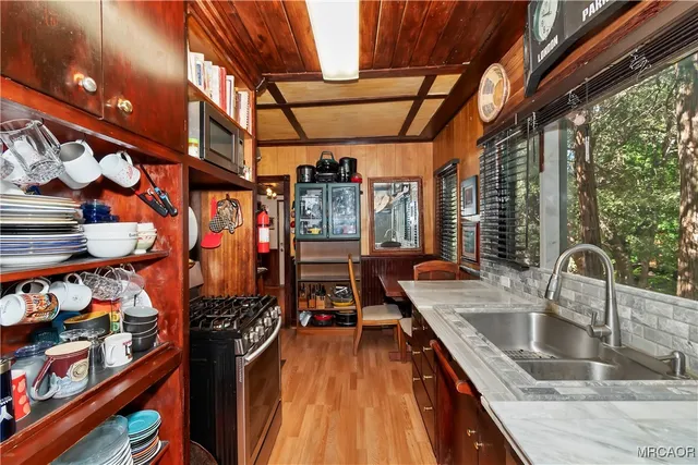 a bed sitting in a bedroom next to a larger window