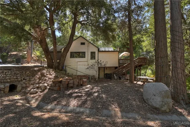 a house with trees in the background