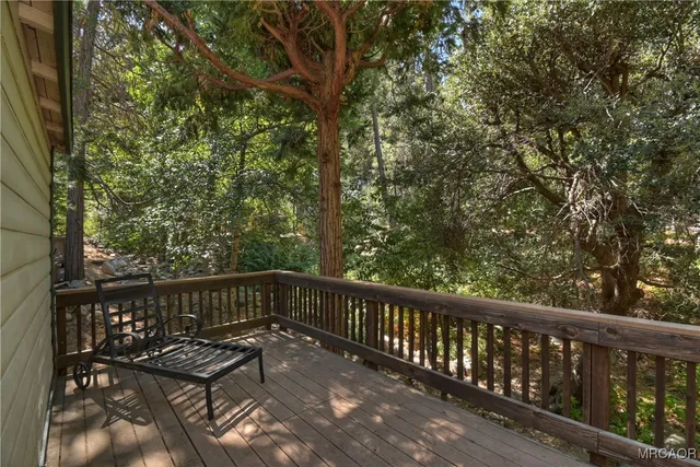 a view of a house with a tree back yard