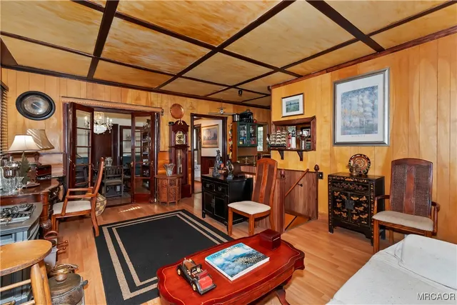 a living room with furniture a rug and a window
